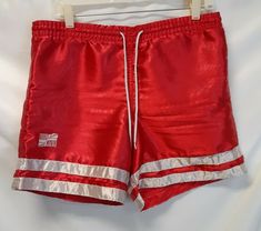 VTG. 90'S UNION JACKS RED SHINY 100% POLYESTER SOCCER ATHLETIC SHORTS Large Good Condition The tag says Adult Small, but the waist measures 34-35 inches which would put these at a large. Shipped with USPS First Class Package. Across Waist: 18" Inseam: 6" Waist to Hem: 15" 90s Style Sports Shorts, Retro Athletic Shorts For Sports, Union Jack, Athletic Shorts, First Class, Soccer, The 100, Football, Red