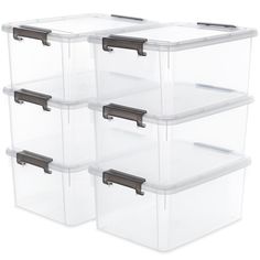 four plastic storage containers with lids and handles