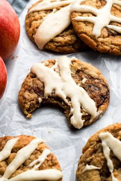 cookies with icing and apples on the side