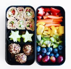 two bento boxes filled with fruit and veggies on top of each other