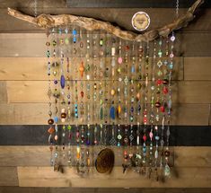 a wooden wall with beads hanging from it