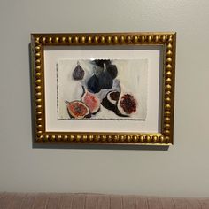 a painting hanging on the wall above a couch