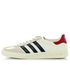 (WMNS) adidas Gazelle x Gucci 'White Navy' 707861-UTT10-9060 (SNKR/Skate/Casual/Women's/Classic/Crossover) Gucci Low-top Sporty Sneakers, Gucci Sporty Low-top Sneakers, Gucci Sporty Sneakers For Streetwear, Gucci Lace-up Sneakers For Streetwear, Adidas Cream Leather Sneakers, White Custom Sneakers With Three Stripes And Round Toe, White Custom Sneakers With Three Stripes Branding, Custom White Sneakers With Three Stripes Branding, Cream Leather Adidas Sneakers