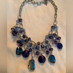 Beautiful Bib Necklace With Blue, Purple And Silver . 18 Inch Plus Extender Purple Metal Necklace For Party, Silver Amethyst Necklaces For Party, Handmade Blue Amethyst Necklace, Blue Amethyst Jewelry, Blue Beaded Amethyst Jewelry, Blue Beaded Amethyst Necklace, Purple Metal Costume Jewelry Necklaces, Purple And Silver, Bib Necklace