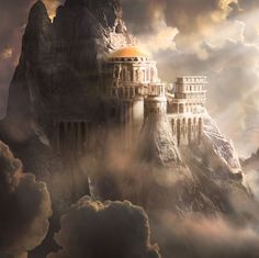 a castle on top of a mountain surrounded by clouds