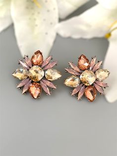 Large Rhinestone crystal stud earring in pink. Prefect statement stud earring for special occasion, date night, wedding or gift for your loved one.  All orders Ship same day if placed before 4:00 PM EST  Create beautiful memory for any occasion with elegant jewelry for your loved ones You will receive carefully packaged items in jewelry box, ready to give memorable gift  to your Wife, mother, sister  friend or colleague. All orders will be shipped  out in 1 business day after receiving order. Pl Rose Gold Cubic Zirconia Flower Earrings For Party, Glamorous Flower Bridal Earrings For Party, Pink Flower-shaped Clip-on Earrings, Pink Flower Clip-on Earrings, Pink Flower Earrings For Evening, Flower Shaped Wedding Earrings With Sparkling Stones, Pink Crystal Earrings For Pierced Ears, Elegant Pink Cubic Zirconia Flower Earrings, Flower-shaped Cubic Zirconia Bridal Earrings For Party