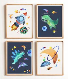 four framed pictures with space themed artwork on the wall in a child's room