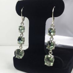 "Beautiful Green Spinel \"Tourmaline\" Leverback Earrings * Oval Cut Green Spinel \"Tourmaline\" measure 10x8mm, 8x6mm and 7x5mm each * 9.8cts total Gemstone weight * Leverback Fastening * Each measure 2 inches Long * Solid Sterling Silver Hallmarked & Gift Ready! Matching Pendant, Ring & Bracelet also Available! These Spinels are laboratory grown stones. They are identical to the genuine stone in every way, including chemistry, composition and hardness, with an outstanding cut, clarity Elegant Oval Tourmaline Earrings, Elegant Round Tourmaline Earrings, Round Tourmaline Gemstone Earrings, Tourmaline Gemstone Earrings In Fine Jewelry Style, Elegant Tourmaline Earrings For Formal Occasions, Tourmaline Gemstone Drop Earrings, Elegant Tourmaline Earrings With Gemstone Accents, Fine Jewelry Tourmaline Earrings For Formal Occasions, Tourmaline Earrings For Formal Occasions