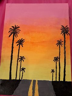 an art project with palm trees painted on the side of a pink background and yellow road