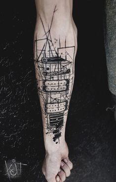 a person's foot with a ship tattoo on it