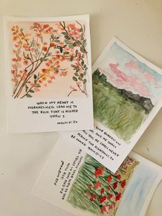 four cards with watercolors on them sitting next to each other and one has a poem written in it