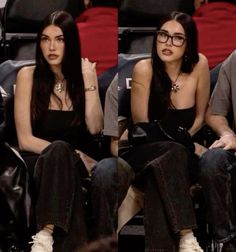 two women sitting next to each other at a basketball game