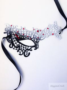 Masquerade Ball Masks Custom made and embellished to match your formal masquerade Party dress or costume. Intricately designed in the half face shape. All Masks come with either matching Ribbons or Stretched Lace. Base Material - Embroidered Lace Mask. All Masks come with either matching Ribbons or Stretched Lace. You may leave a note during checkout if you have a preference. Mask is available in left eye or right eye covered mask. You can leave a note during check out if you have a preference. Handmade Fantasy Masquerade Mask For Costume Party, Adjustable Black Masquerade Mask For Carnival, Black Adjustable Masquerade Mask For Carnival, Black Masquerade Mask For Halloween Gift, Black Adjustable Masquerade Mask, Adjustable Mask For Masquerade, Gothic Masquerade Eye Mask, Gothic Style Masquerade Eye Mask, Gothic Eye Mask For Masquerade