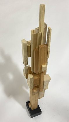 a sculpture made out of wood on a white background