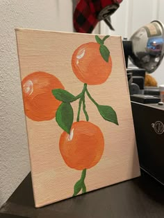 an orange painting is sitting on a table