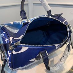 SHOP MORE LUXURY PRODUCTS HERE Description Louis Vuitton Escale Speedy BandouliÃƒÂ¯Ã‚Â¿Ã‚Â½ÃƒÂ¯Ã‚Â¿Ã‚Â½ÃƒÂ¯Ã‚Â¿Ã‚Â½ÃƒÂ¯Ã‚Â¿Ã‚Â½re 30 Monogram Canvas Blue For Women, Women’s Handbag Shoulder And Crossbody Bags 11.8in/30cm LV M45146 Tie-Dye Monogram canvas brings a beachy feel to the Speedy BandouliÃƒÂ¯Ã‚Â¿Ã‚Â½ÃƒÂ¯Ã‚Â¿Ã‚Â½ÃƒÂ¯Ã‚Â¿Ã‚Â½ÃƒÂ¯Ã‚Â¿Ã‚Â½re 30, a classic Louis Vuitton city bag relooked for the LV Escale Collection. The rolled-leather handles and distinctive shape make this bag immedi Designer Blue Satchel With Large Capacity, Designer Navy Bags For Daily Use, Luxury Large Capacity Blue Satchel, Designer Blue Satchel With Adjustable Strap, Navy Bag With Top Handle, Navy Shoulder Bag With Handles, Designer Navy Bag For Everyday Use, Designer Navy Rectangular Bags, Navy Designer Rectangular Bag