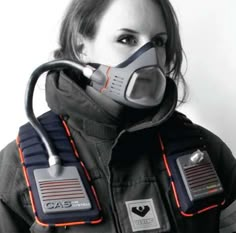 a woman wearing a gas mask and protective gear with the words international design excellence awards 2011