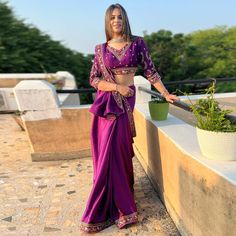 Purple colored saree is made from art silk fabric which is highlighted with beautiful sequins embroidered work as shown. comes along unstitched embroidered banglori silk blouse piece which you can customise as per your design/style. Occasion - You can wear this saree for festive, functions and ideal for any fashionista. Note:- The actual product may differ slightly in color and design from the one illustrated in the images when compared with computer or mobile screen. Traditional Draped Art Silk Saree With Mirror Work, Traditional Drape Art Silk Pre-draped Saree With Mirror Work, Eid Art Silk Pre-draped Saree With Mirror Work, Eid Mirror Work Pre-draped Art Silk Saree, Traditional Drape Pre-draped Saree With Mirror Work, Bollywood Style Embroidered Pre-draped Saree For Diwali, Embroidered Purple Pre-draped Saree For Navratri, Eid Pre-draped Art Silk Saree With Mirror Work, Purple Art Silk Pre-draped Saree For Navratri