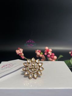 Beautiful ring with clear bikaneri kundan stones setted intricately along with cubic zirconia in the center rim to give that sparkling effect. Finished with meenakari at the back side and completely adjustable to fit everyone. *Gemstone: Glass stones set in silver foil and covered with meenakari at back. *Size: 1.25 inch in diameter, 16g in weight. Adjustable band. *Finish/plating: Gold. Elegant, versatile ring for a statement yet sophisticated look! Please read our FAQ/policies section before p Bollywood Style Cutdana Jewelry For Anniversary, Silver Bridal Sets For Diwali, Kundan Cutdana Jewelry For Anniversary, Bollywood Kundan Jewelry For Anniversary, White Stone Work Wedding Gift, Traditional Gold Cubic Zirconia Wedding Jewelry, Jeweled Toe Ring For Wedding, Jeweled Wedding Ring, Kundan Jewelry With Cutdana For Anniversary