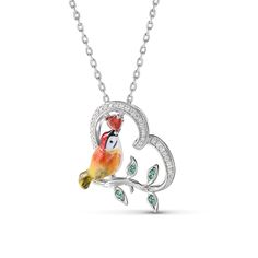 Designed for the free-spirited, the kingfisher is symbolic of freedom, courage, adventure, and balance. Each piece has been delicately hand-painted, displaying the uniqueness of its bright yellow feathers and orange plumage against a silver base. It is a true gift to spot one of these elusive creatures in nature.Carat Weight: 0.341 ctStone Size: 1,3*3,0.8 mmStone Type: Jeulia® StoneNumber of Stones: 44 Stone Shape: Round, HeartStone Color: Diamond White, Garnet RedChain Type: Cable chainWeight: Nature-inspired Multicolor Jewelry Gift, Symbolic Multicolor Jewelry For Gift, Symbolic Multicolor Necklaces For Gifts, Symbolic Multicolor Necklace For Gift, Nature-inspired Artistic Jewelry Gift, Adjustable Bird Design Jewelry As Gift, Nature-inspired Artistic Jewelry For Gifts, Whimsical Artistic Design Jewelry Gift, Whimsical Artistic Design Jewelry For Gift