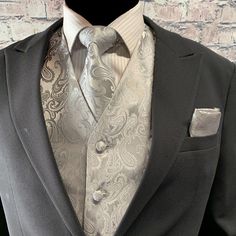 Elegant Groom's Set With Ties, Elegant Sets With Ties For Groom, Elegant Wedding Suit And Tie Accessories, Fitted Wedding Suits With Pocket Square, Elegant Fitted Silver Suit, Silver Fitted Elegant Suit, Classic Silver Tie For Groom, Formal Suits With Pocket Square, Elegant Fitted Suits With Pocket Square