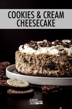 cookies and cream cheesecake on a white plate with oreo crackers around it