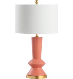 a pink table lamp with a white shade on it and gold trim around the base