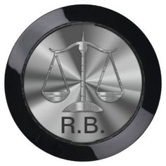 a black and silver metal plate with the word r b on it