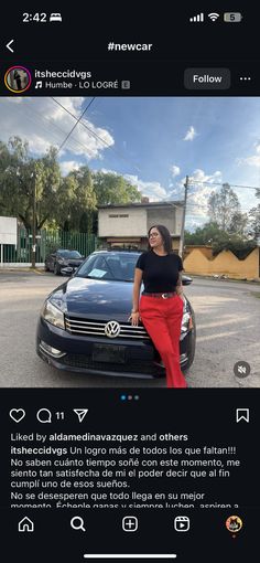 a woman leaning on the hood of a car in front of a building with an instagram