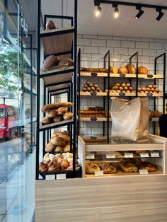 a bakery filled with lots of bread and pastries