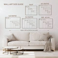 a white couch sitting in front of a wall with measurements on the walls above it