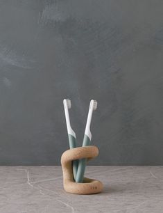 This sculptural holder is an eye-catching addition to your bathroom decor, as it stylishly wraps around your toothbrushes. Shop this ceramic toothbrush holder. Clay Toothbrush Holder, Tooth Brush Holder, Ceramic Toothbrush Holder, Bedroom Decor Lights, Toothbrush Storage, Mantel Mirrors, Dining Design, Wall Lights Bedroom, Bright Living Room