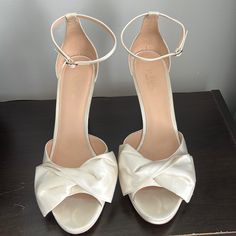 Wore These Beauties For Less Than An Hour At My Destination Wedding October 21’ And They Were Incredibly Comfy And Complimented My Wedding Gown Beautifully Originally Purchased For $198.00 And Still Selling On Neiman Marcus And Kate Spade Online Still Have Original Box And Cloth Bag To Transport Them And Keep Them Beautiful And Spot Free Satin Lining: 100% Kid Leather 4" Platform Heel Buckle Closure At Ankle Strap Imported Style No. K0006 Classic Cream Heels For Wedding, Classic 4-inch Heel Wedding Shoes, Classic Wedding Shoes With 4-inch Heel, Classic Cream Wedding Heels, Cream Bridal Accessories For Formal Occasions, Elegant Open Toe Wedding Shoes For Bride, Kate Spade White Round Toe Heels, Kate Spade White Open Toe Heels, Elegant Cream Heels For Bride