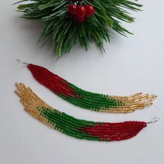 Red green gold fringe earrings Shoulder duster earrings Long | Etsy Handmade Gold Beaded Earrings For Christmas, Bohemian Christmas Earrings For Festive Occasions, Handmade Festive Drop Tassel Earrings, Red Tassel Earrings For Festive Occasions, Bohemian Christmas Earrings, Handmade Red Tassel Earrings For Festive Occasions, Gold Tassel Earrings With Colorful Beads As Gift, Handmade Festive Tassel Earrings, Bohemian Beaded Earrings For Christmas