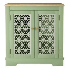 a green cabinet with laser cutouts on the doors and drawers is shown in front of a white background