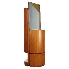 a wooden stand with a mirror on it's side and a shelf underneath the mirror