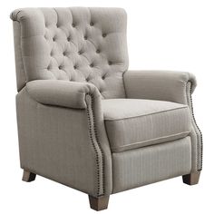 a gray chair with buttons on the armrests and nail polishing around the arms