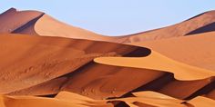 sand dunes in the desert with blue sky