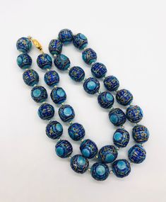 Absolutely beautiful vintage/antique Chinese export 800 silver and enamel beaded necklace. Large chunky sterling silver enameled open work beads in two shades of blue. Hand knotted on silk with sterling silver vermeil clasp. The push in box clasp works perfectly and it secure but the small tongue is missing. Enough of the clasp is there to open and close. May want to replace the piece but it works well. Not marked in any way but acid is as 800 silver (continental silver) I have looked each bead Traditional Blue Necklaces For Formal Occasions, Traditional Blue Oval Bead Necklaces, Traditional Blue Oval Beads Necklaces, Traditional Blue Oval Beaded Necklaces, Vintage Blue Enamel Necklace, Traditional Blue Oval Beads Jewelry, Traditional Blue Oval Beaded Jewelry, Silver Meenakari Round Bead Jewelry, Festive Blue Jewelry With Large Beads