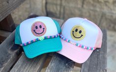 Customized Smiley Face Patch Trucker hat with customized bead chain. Just line the charms along the rope on the hat and then attach the clasps through the holes in the mesh (not onto the rope) on both sides of the bill. The bead charms are fully customizable! We have neon, matte or colorful (shiny) beads with the option to add shapes and/or your name/saying. Include a note in the personalization section if you would like the following on your charm: - name - bead color preference (I have found 3 colors work the best) - symbols/shapes (e.g. evil eye, rose, star, smiley face, peace sign, heart) CHARM DESIGN: Each charm is handmade. Since each charm is hand-made, variations in color and placement are to be expected; meaning each one is unique! TRUCKER HAT: Materials: Polyester, Nylon, Foam, V Cute Adjustable Mini Hats For Festivals, Face Patches, Happy Face, Smiley Face, Peace Sign, Beaded Chain, Trucker Cap, Smiley, Trucker Hat