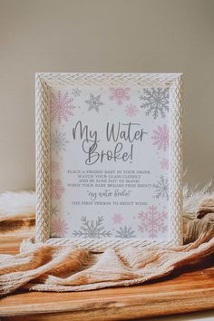 a card with the words, my water broke on it and snowflakes around it