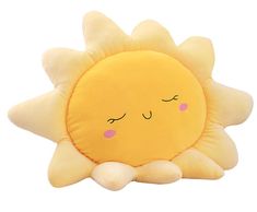 a yellow sun pillow with eyes closed