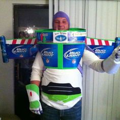 a man wearing a costume made to look like he is holding two beer cans on his shoulders