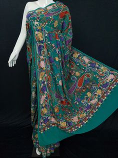 "Pure Georgette Exquisite Hand Embroidered Saree \"With Hand Embroidered Blouse\" Gorgeous Hand Embroidered Kashmiri Saree, which you can wear at Any Occasion About this Saree : We have for the sophisticated stylist in you, the one who loves elegance, who loves to be luxurious in their style, a gorgeous, graceful Green Hand embroidered saree to add to your graceful closet another deluxe star. The saree comes with its blouse and is adorned in the sheer splendor of Kashmiri Cotton And Mettalic Til Eid Multicolor Embroidered Pre-draped Saree, Designer Green Pre-draped Saree With Motifs, Ceremonial Embroidered Fabric With Motifs, Ceremonial Silk Dupatta With Chikankari Embroidery, Silk Saree With Multicolor Embroidery And Motifs, Ceremonial Saree With Cutdana, Transitional Green Embroidered Saree, Transitional Embroidered Green Saree, Embroidered Katan Silk Fabric For Navratri