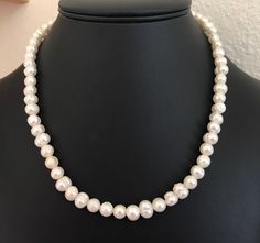 This string of 8mm genuine white cultured pearl beads is a wonderful necklace. The beads are very uniform and have wonderful oval shapes. The pearl necklace is 19 inches long and have a silver tone barrel clasp. I specialize in finding fun wearable costume jewelry. Please browse my shop for more options. I keep my eyes out for genuine pearl necklaces. I box jewelry sales ready to be given as gifts. Classic Oval Pearl Necklace, Classic Oval Bead Necklace For Formal Occasions, Classic Formal Necklace With Oval Beads, Classic White Pearl Necklace With Round Beads, White Single Strand Pearl Necklace With Oval Beads, White Oval Beads Single Strand Pearl Necklace, Genuine Pearl Necklace, Wire Cuff, Copper Bracelet