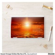 the sun is setting over the ocean with an inspirational quote on it, along with some office supplies