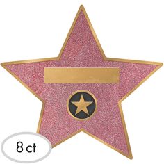 a pink star with a gold border and a name tag on the bottom, in front of a white background