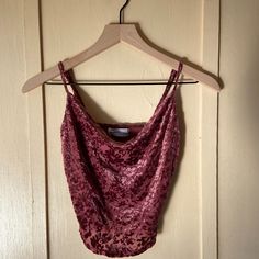 This Velvet Cami Is So Freaking Cute! I Wish It Looked Good On Me, But Cowl Necks Are Not My Thing. The Velvet On The Outside Has A Very Soft Touch To It. The Straps Are Adjustable, And The Fit Is A Bit Cropped. Brand: Urban Outfitters Size: Xs Color: Mauve Fabric: 60% Polyester 30% Nylon 10% Spandex Condition: Never Worn, In Excellent Condition, No Damage This Item Comes From A Household With Cats. Please Proceed With Caution If You Have Severe Allergies. Purple Cami Top For Party, Fitted Pink Crop Top From Urban Outfitters, Fitted Pink Crop Top By Urban Outfitters, Fitted Camisole Tops By Urban Outfitters, Urban Outfitters Fitted Camisole Top, Fitted Cami Crop Top By Urban Outfitters, Urban Outfitters Fitted Cami Crop Top, Purple Fitted Cami Top, Urban Outfitters Fitted Tank Top For Night Out