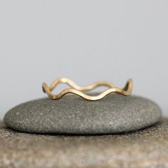 This set is for the sun worshippers and the beach combers, whose hearts keep pulling them to the sea. Simple and clean in aesthetic, yet imbued with all the timeless symbolism of the ocean waves and the rising sun. This is a set of two rings: one Sunrise Ring, and one Wave Ring. The two rings nestle perfectly together to create one elegant statement. Available in all sterling, sterling mixed with 14k gold fill, or all 14k gold fill All Rebecca Haas Jewelry is made by hand in my Southern Vermont