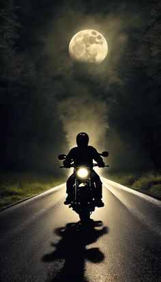 a person riding a motorcycle on a road at night with the moon in the background